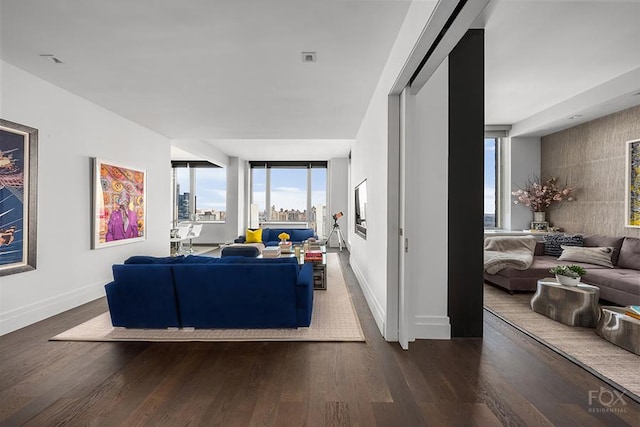 living area featuring wood finished floors and baseboards