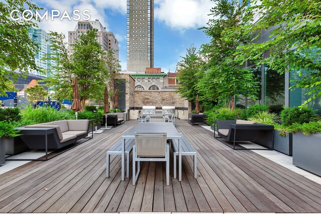 388 Bridge St Unit Ph50D, New York City, NY 11201 - wooden terrace with outdoor lounge area and area for grilling