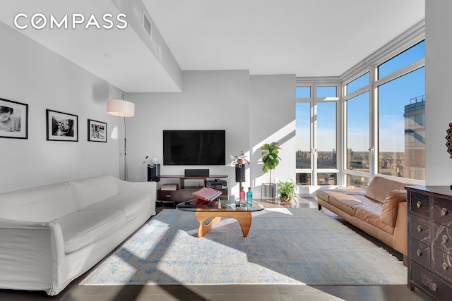 living room featuring floor to ceiling windows