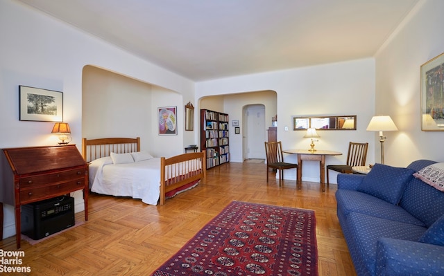 bedroom featuring arched walkways