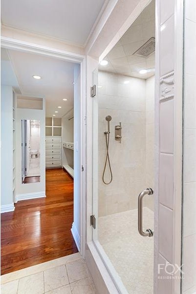 510 E 86th St Unit 14C, New York City, NY 10028 - full bathroom with a stall shower and wood finished floors