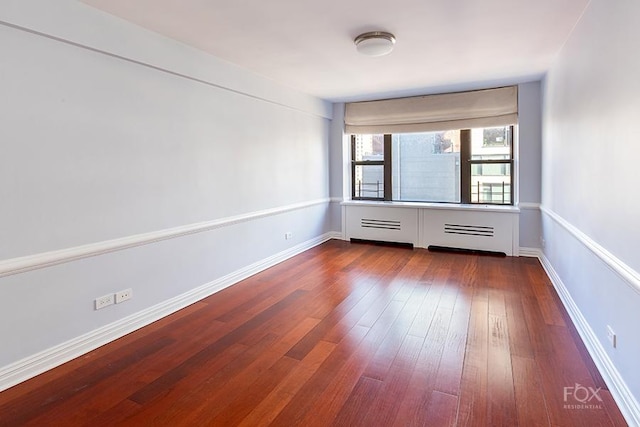 510 E 86th St Unit 14C, New York City, NY 10028 - unfurnished room featuring dark wood-style floors and baseboards