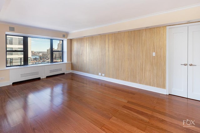 510 E 86th St Unit 14C, New York City, NY 10028 - unfurnished room with wood finished floors and crown molding