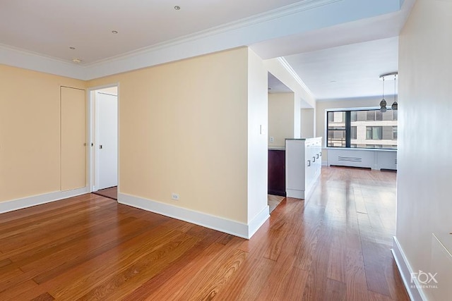 510 E 86th St Unit 14C, New York City, NY 10028 - unfurnished room with wood finished floors, ornamental molding, and baseboards