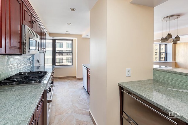 510 E 86th St Unit 14C, New York City, NY 10028 - kitchen featuring reddish brown cabinets, appliances with stainless steel finishes, decorative backsplash, light marble finish floors, and decorative light fixtures