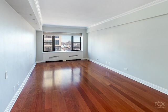 510 E 86th St Unit 14C, New York City, NY 10028 - unfurnished room featuring wood finished floors, baseboards, and crown molding