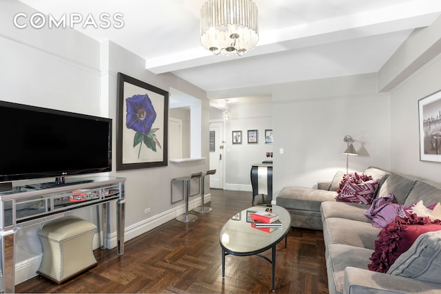 living room with an inviting chandelier and baseboards