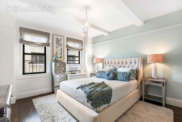 bedroom with beam ceiling, cooling unit, baseboards, and wood finished floors