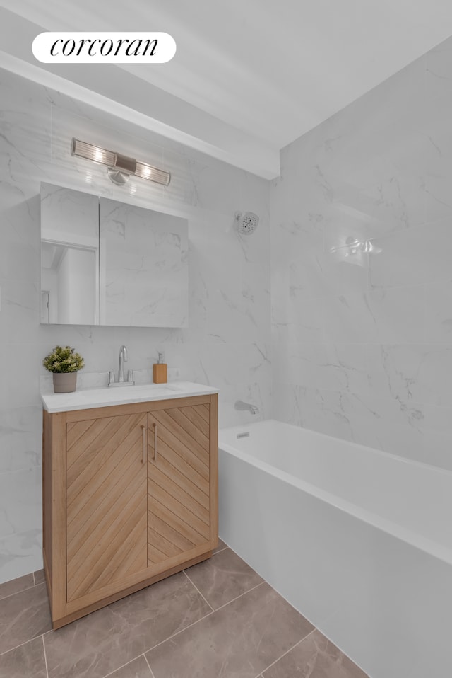 bathroom featuring vanity and washtub / shower combination