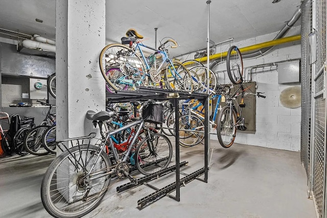 garage with bike storage and concrete block wall