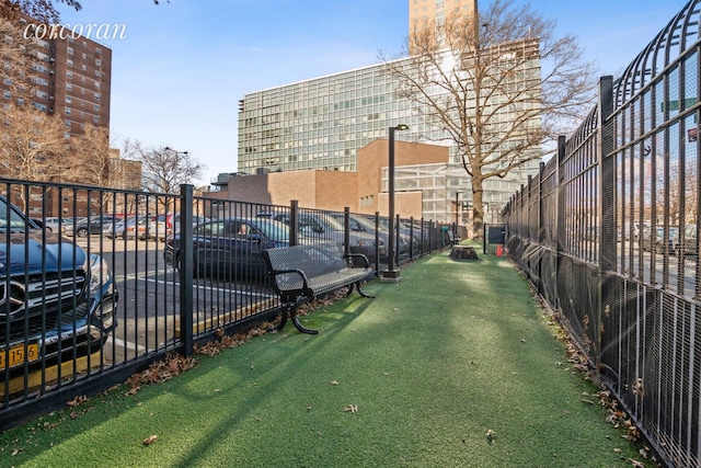 view of community with fence