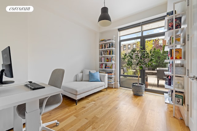 office area featuring visible vents and wood finished floors