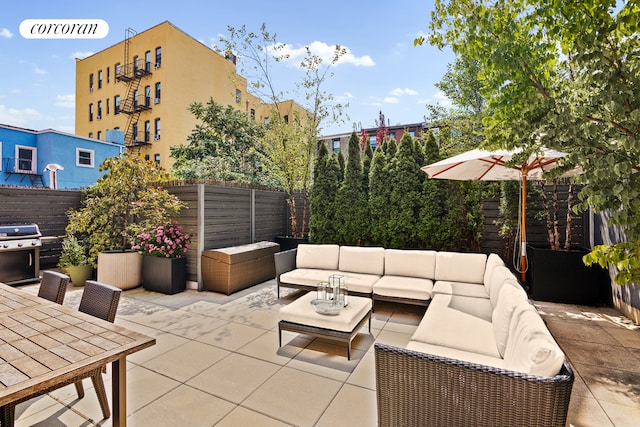 view of patio / terrace featuring grilling area, outdoor lounge area, and fence