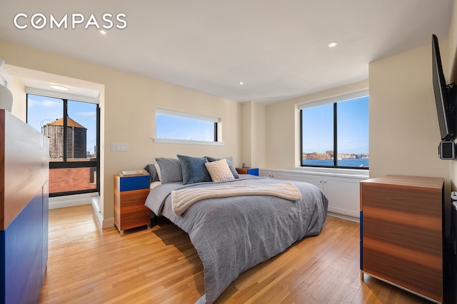 bedroom featuring recessed lighting, light wood finished floors, and baseboards