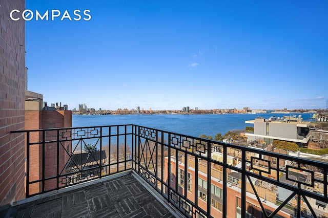 balcony featuring a water view