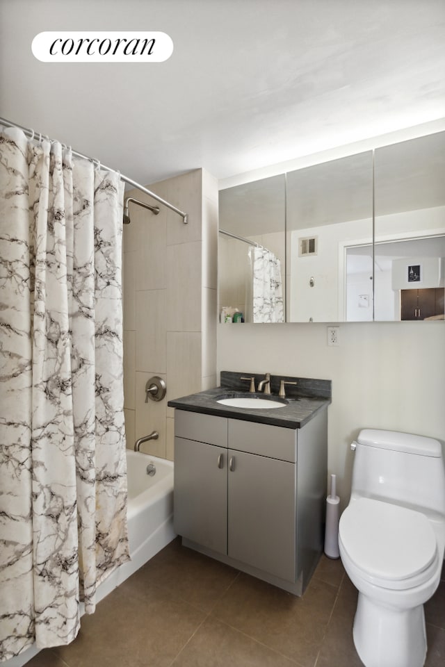 full bathroom with tile patterned flooring, visible vents, vanity, and shower / bath combo with shower curtain