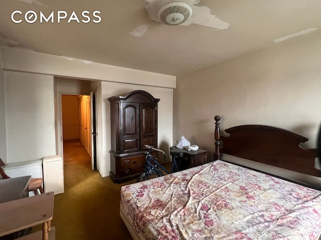 carpeted bedroom with a ceiling fan