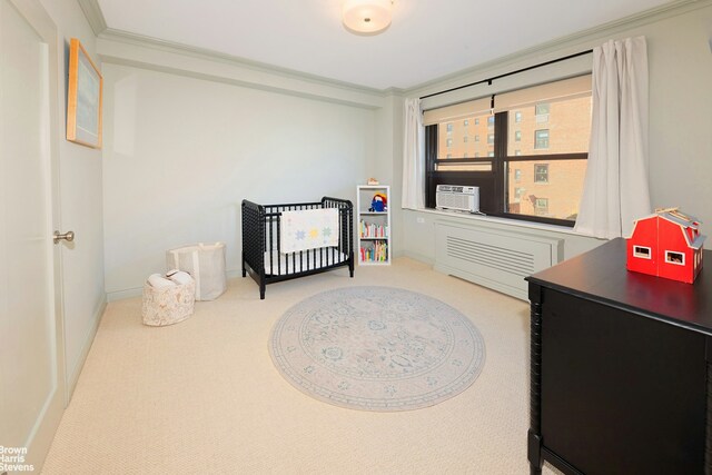 carpeted bedroom featuring baseboards, cooling unit, and crown molding