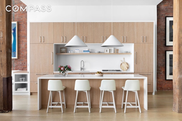 kitchen featuring open shelves, modern cabinets, and light brown cabinetry