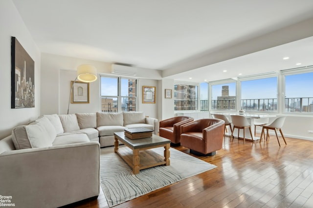 417 Grand St Unit D1801, New York City, NY 10002 - living room with a wall unit AC and hardwood / wood-style flooring