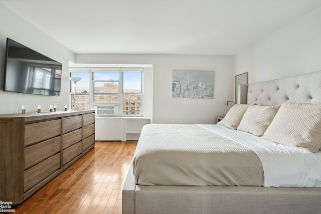 bedroom featuring light wood-style flooring
