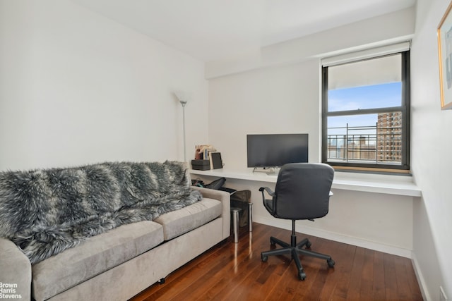 office area with baseboards and hardwood / wood-style floors