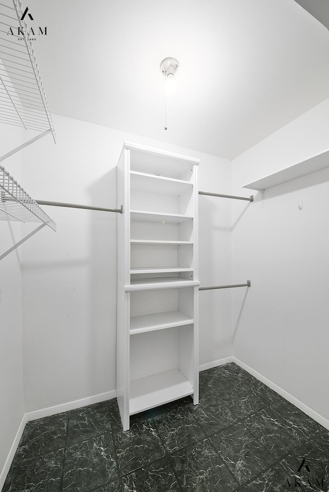 211 Thompson St Unit 4-C, New York City, NY 10012 - walk in closet featuring marble finish flooring