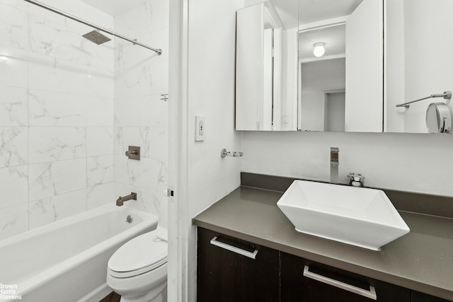 full bathroom with shower / washtub combination, vanity, and toilet