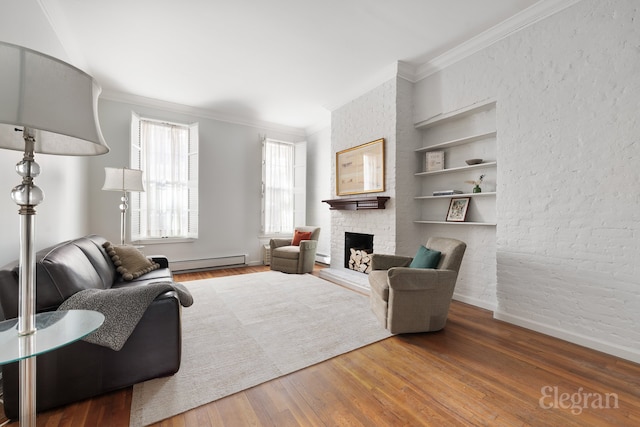 living room featuring baseboards, built in features, hardwood / wood-style flooring, baseboard heating, and a fireplace