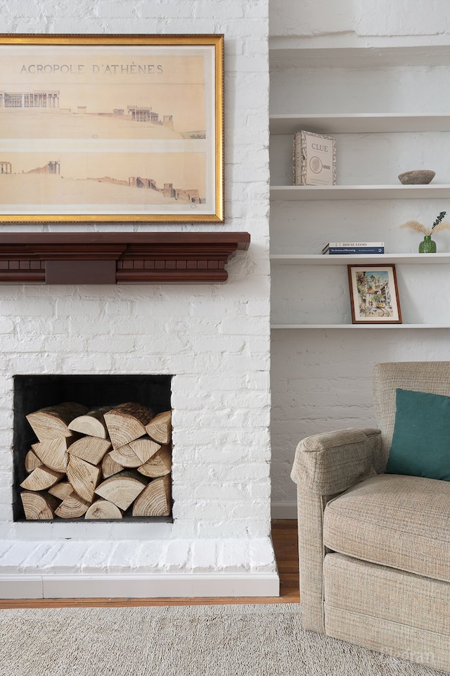 room details with a fireplace and wood finished floors