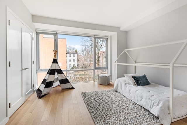 bedroom with hardwood / wood-style flooring