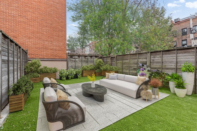 view of patio with outdoor lounge area and a fenced backyard