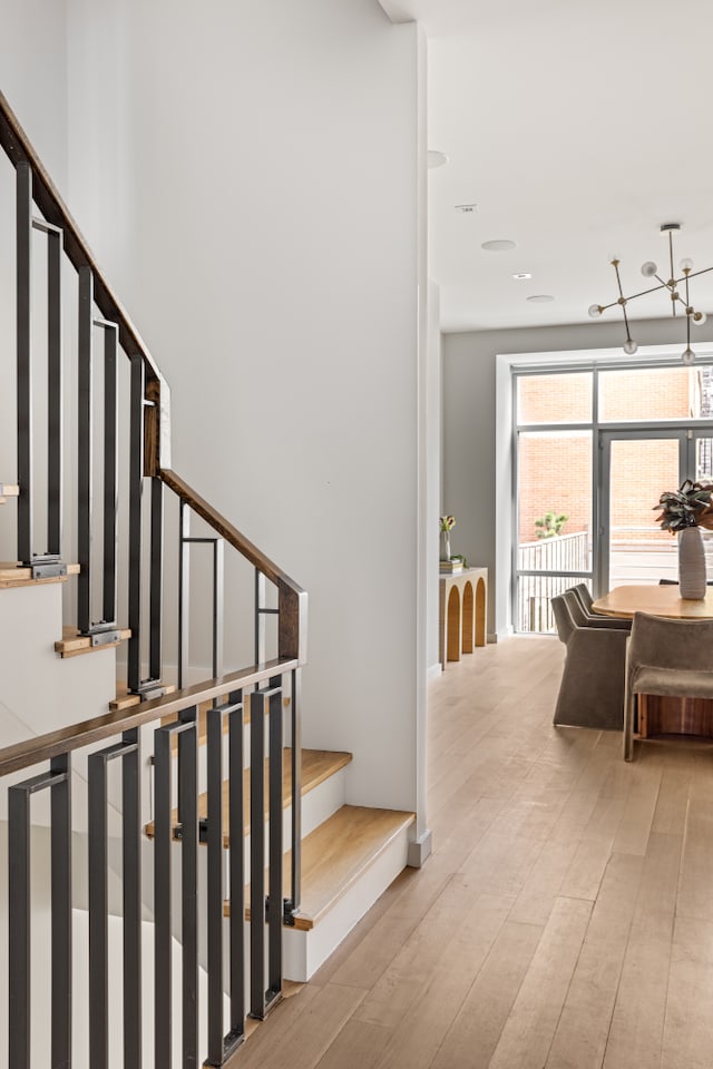 stairway with wood finished floors