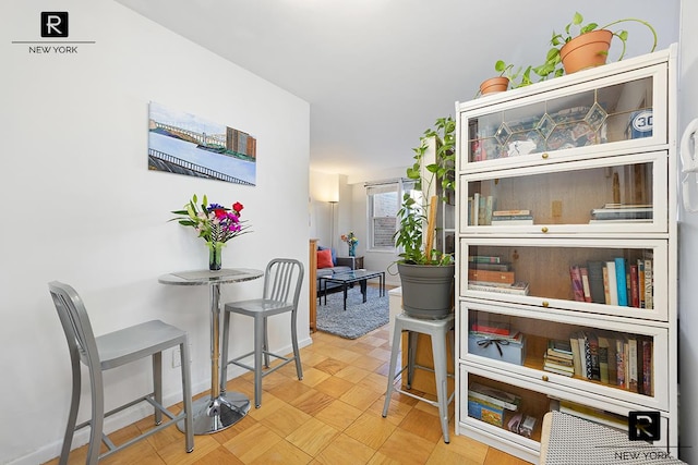 dining room featuring baseboards