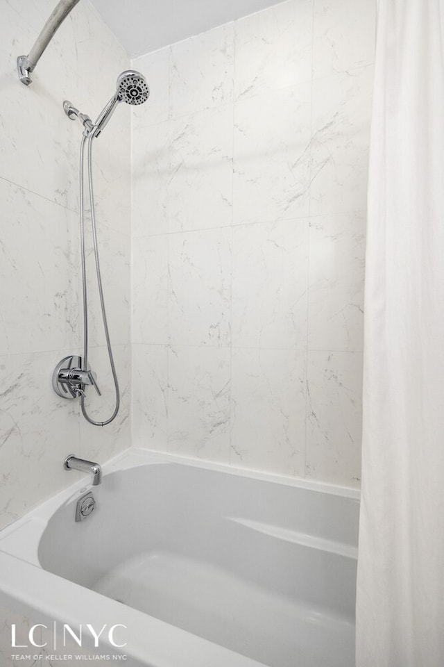 full bathroom featuring shower / bath combination with curtain