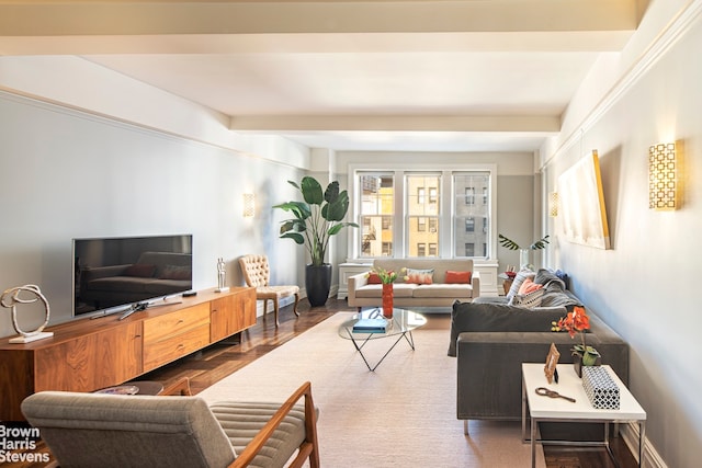 living room featuring beamed ceiling