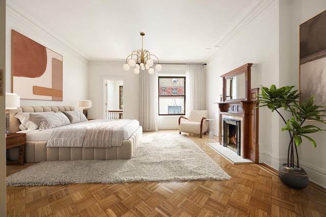 bedroom with baseboards, ornamental molding, a warm lit fireplace, and a chandelier