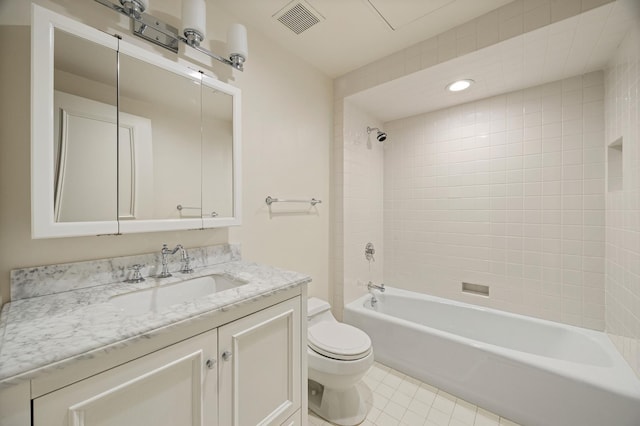 full bath with visible vents, bathing tub / shower combination, toilet, tile patterned floors, and vanity