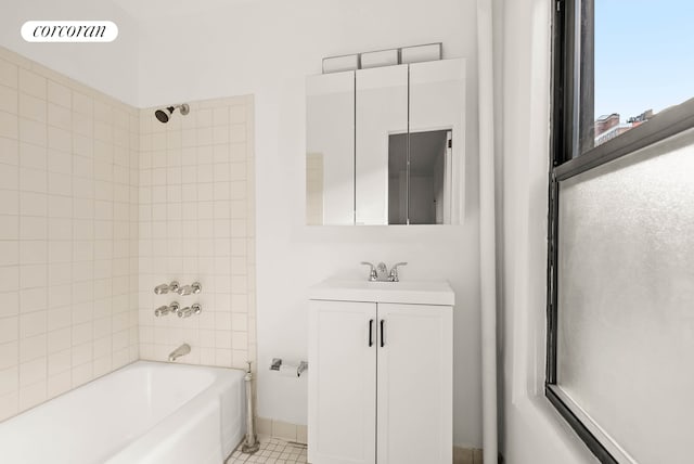 full bathroom with tile patterned flooring, vanity, visible vents, baseboards, and shower / washtub combination