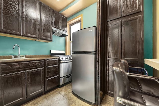 kitchen featuring a sink, dark brown cabinets, under cabinet range hood, and stainless steel appliances