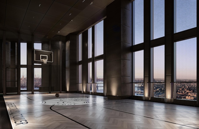 view of basketball court featuring a healthy amount of sunlight and community basketball court