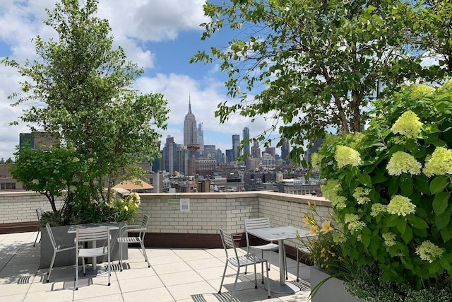 175 W 13th St Unit 3G, New York City, NY 10011 - balcony featuring a view of city, a patio area, and outdoor dining space