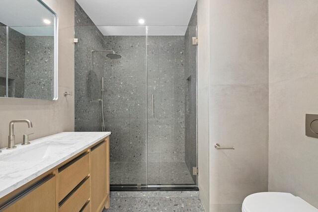 full bath featuring vanity, recessed lighting, a shower stall, and toilet