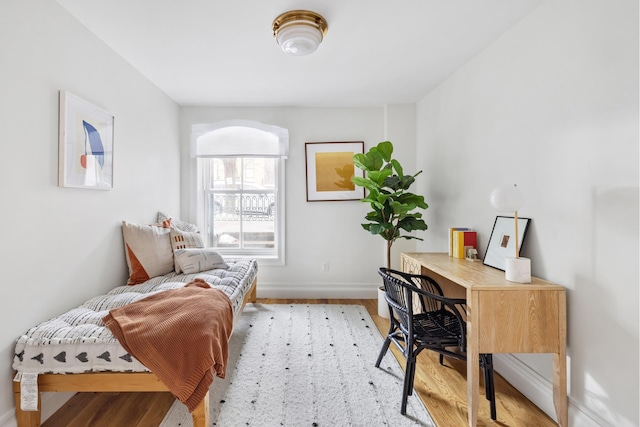 office with light wood-style flooring and baseboards