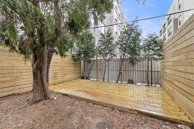 view of yard featuring a fenced backyard and a deck