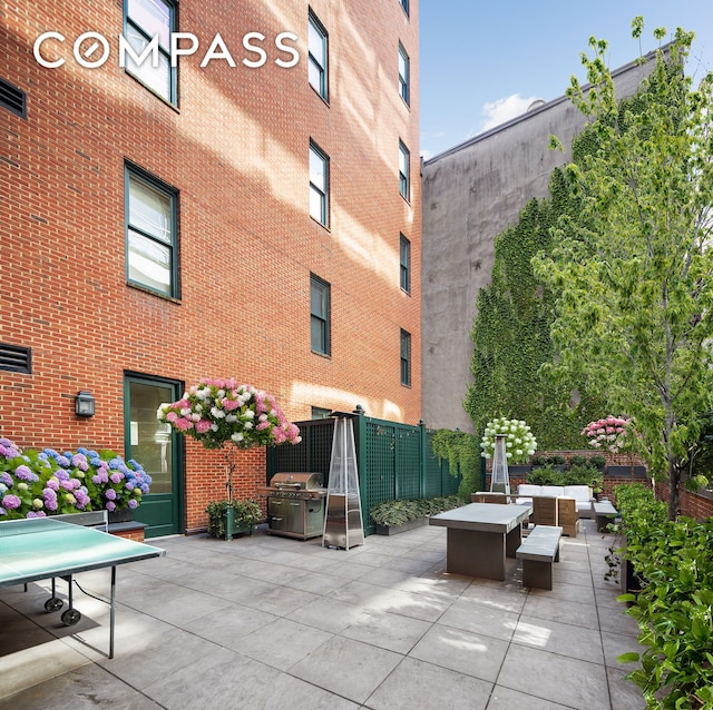 view of patio featuring a grill and an outdoor hangout area