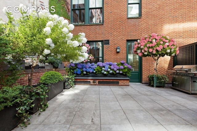 exterior space featuring fence and grilling area