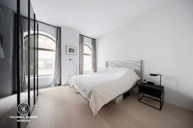 bedroom featuring light wood-style flooring