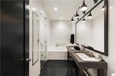 full bathroom with a washtub and vanity