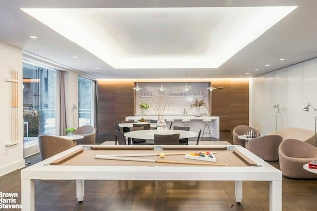 rec room featuring pool table, a tray ceiling, wood finished floors, and recessed lighting